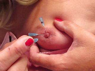 Lingerie Sissy putting needles in her own nipples 2